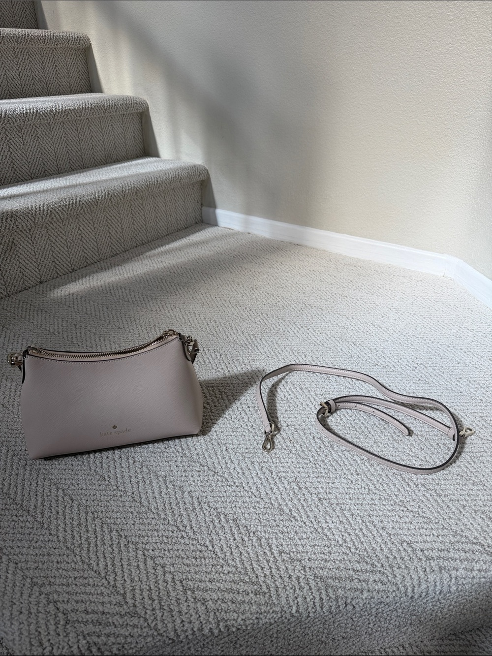 kate spade Small Pebbled Leather Crossbody in an ivory color.